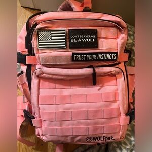 35L wolfpak. Knockout pink! Lightly used